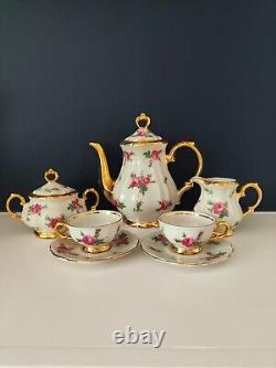 Ensemble de café en porcelaine Bareuther Bavaria décoré de roses roses vintage et d'or, en très bon état.