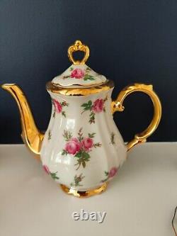 Ensemble de café en porcelaine Bareuther Bavaria décoré de roses roses vintage et d'or, en très bon état.
