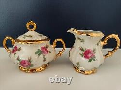 Ensemble de café en porcelaine Bareuther Bavaria décoré de roses roses vintage et d'or, en très bon état.