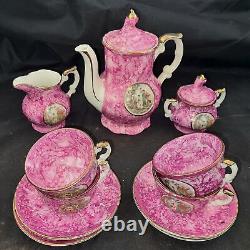 Service à café vintage avec scène de Limoges, pot à sucre, crémier, tasses à café en porcelaine avec motif de rose.