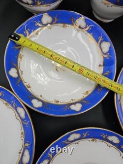 Service à thé et à café en porcelaine vintage de 23 pièces, bleu cobalt et dorure à l'or, tasses, soucoupes et assiettes.